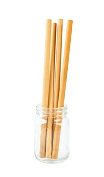 Bamboo straws tube drink water in glass isolated on white background, Save clipping path.