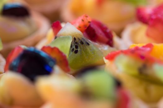 colorful fruit as decoration on fruit tart