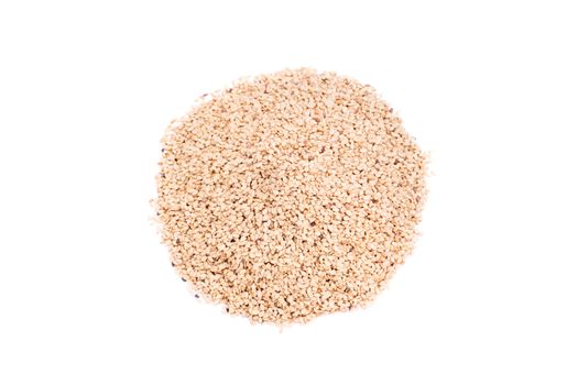 Top perspective of a heap of sesame seeds, isolated on white background.