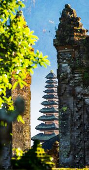 Pura Ulun Danu Beratan temple seen through a stone gate in Bali, Indonesia