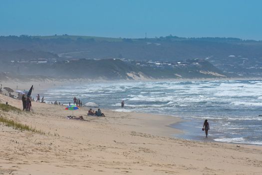 Hot summers day on a crowded African south coast beach, Mossel Bay, South Africa