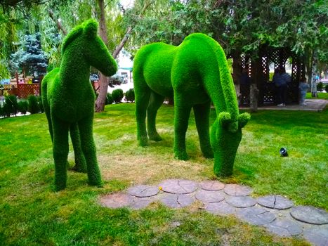  Life-size sculpture of green horses in the Park.