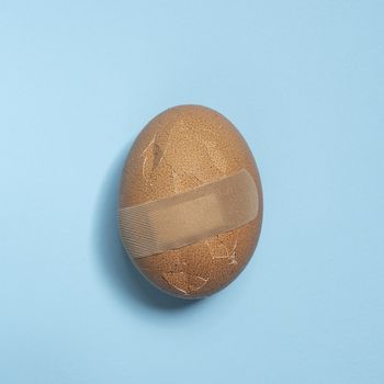 A wounded egg with a plaster