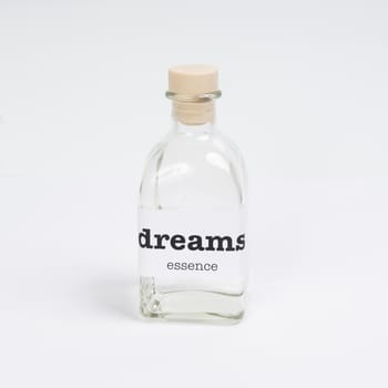 a glass bottle containing dreams essence