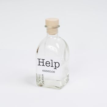 a glass bottle containing Help essence