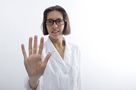 Female doctor raised her hand in greeting