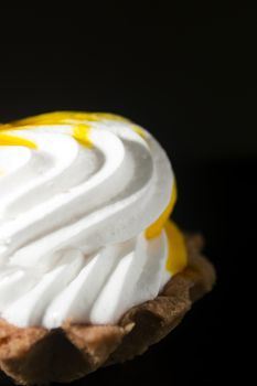 Cake Basket with cream and jam on a black background