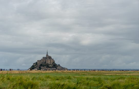 Normandy abbey attraction for vacation tourism in cloudy weather