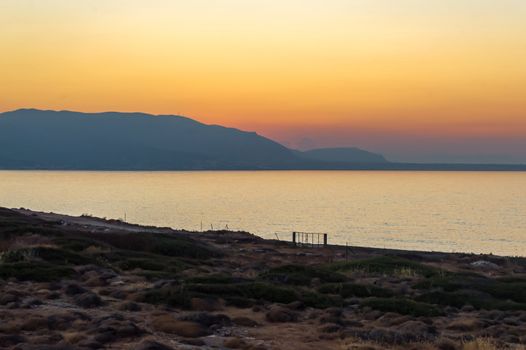 Sunset on the sea near the village of Sissi in Crete