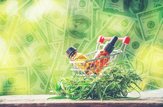 cannabidiol (cbd) extract in a shopping cart and dollar banknote background