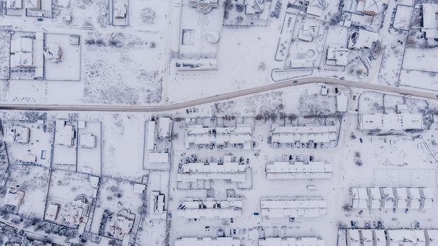 Aerial view on winter village. Many houses.