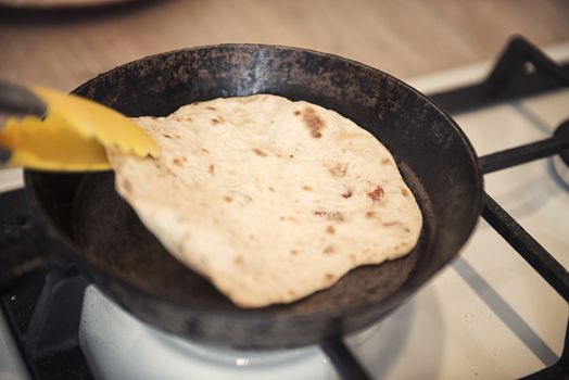 Greek pita bread on the old skillet.