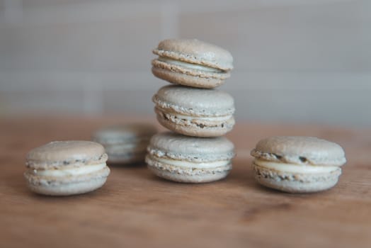 Cake macaron or macaroon on grey background, sweet and colorful dessert.