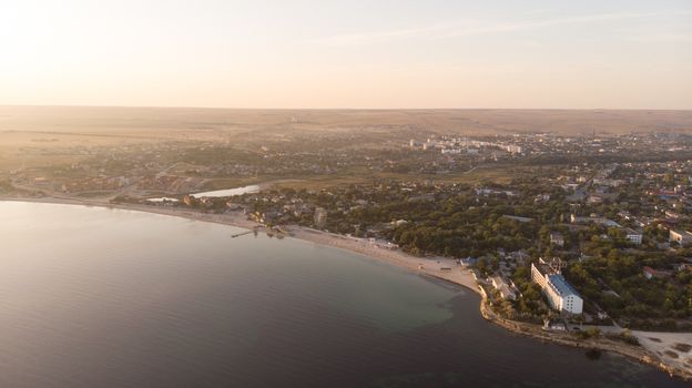 Aerial view on town. Beautiful morning and sunrise. Photo of the village at an altitude of 500 meters.