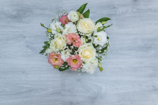 Garden flowers over grey wooden table background. Backdrop with copy space.