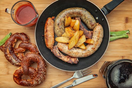 sausage grill in a cast iron pan on wooden table