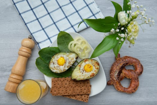 Eggs baked in avocado on plate with