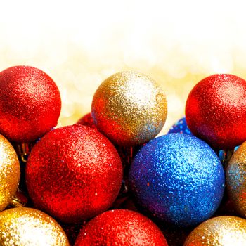 Pile of colorful Christmas balls with blurred background