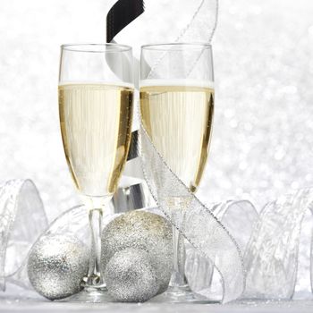 Champagne and decor on silver bokeh background