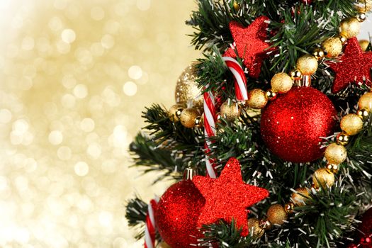 Beautiful christmas tree decorated with baubles and candies
