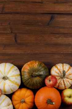 Many orange pumpkins on wooden background , Halloween concept , top view with copy space