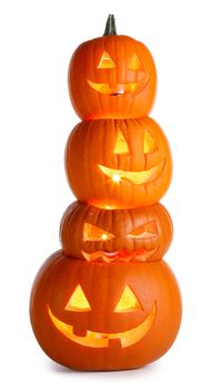 Stack of glowing Halloween Pumpkins isolated on white background