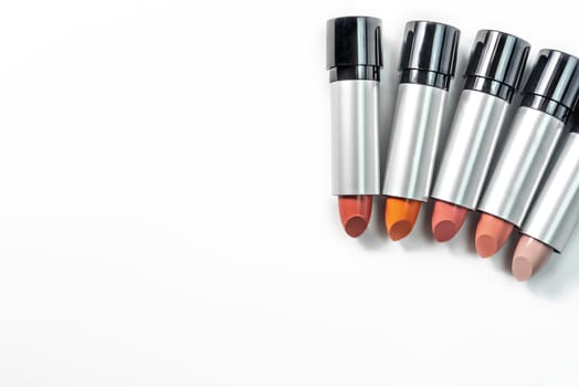 Set of colorful lipsticks on white background