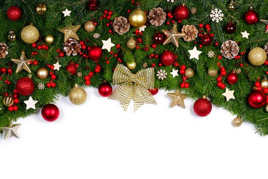 Christmas Border frame of tree branches on white background with copy space isolated, red and golden decor, berries, stars