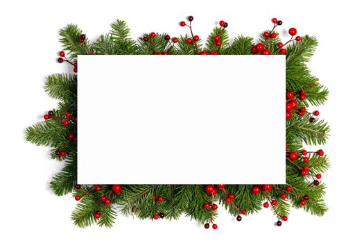 Christmas Border frame of tree branches and red berries on white background with copy space isolated
