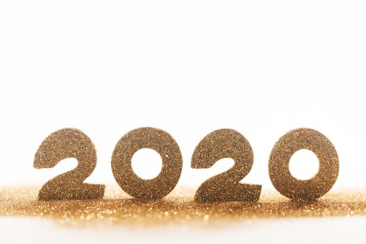 2020 New Year luxury design concept. Golden 2020 New Year horizontal template with golden glitter isolated on white backgound