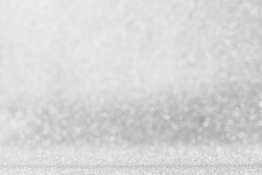Shiny silver bokeh glitter lights abstract background, Christmas New Year party celebration concept