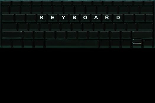 The word “ KEYBOARD " on the blank computer keyboard button in darkness background. Top view and copy space for text.