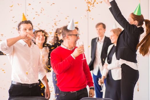 Business people celebrating New Year at office party