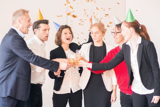 Business people celebrating New Year at office party