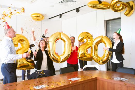 Business people celebrating 2020 New Year at office party