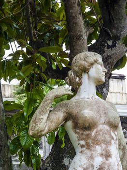 Achilleion palace, Corfu, Greece - August 24, 2018: Statue in the courtyard of Achilleion palace of Empress of Austria Elisabeth of Bavaria.