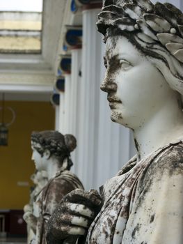 Achilleion palace, Corfu, Greece - August 24, 2018: Statues of the nine muses at Achilleion Palace, island of Corfu. Achilleion was built by Empress Elisabeth of Austria, known as Sissi.