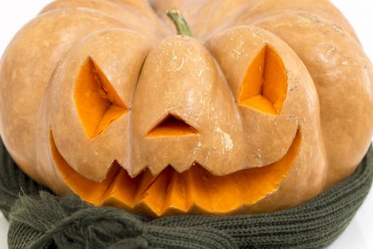 orange halloween pumpkin with carving, crushed and collapsible typology, on a background in nature or white