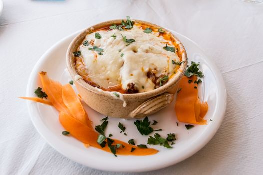 Veal ramequin au gratin with feta cheese with Greek pasta