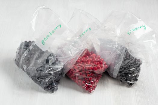 Berries laid out on a bags and prepared for freezing and storage.