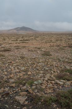 Plains and Tindaya Mountain in the background. Tindaya Mountain Natural Monument. La Oliva. Fuerteventura. Canary Islands. Spain.