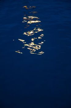 Artificial light reflected in the water. Los Cristianos. Arona. Tenerife. Canary Islands. Spain.