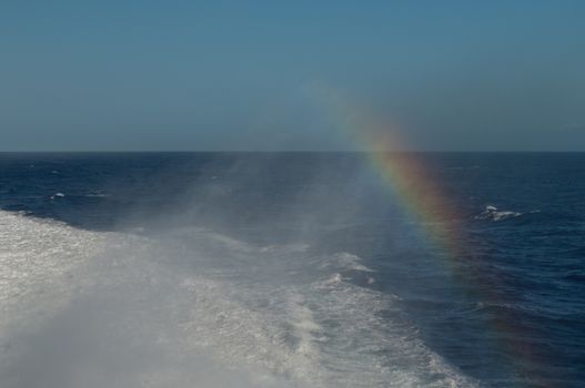 Wake and rainbow left by a ship. Atlantic Ocean. Canary Islands. Spain.