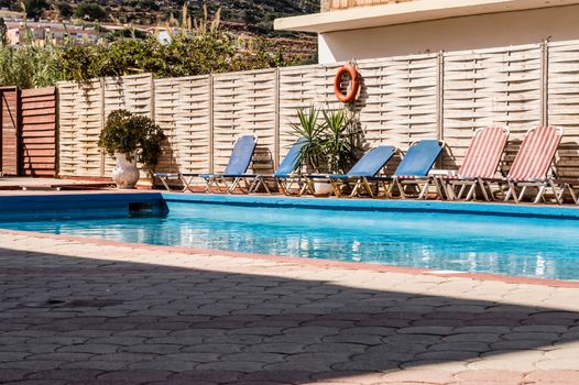 Small rectangular pool with loungers in a hotel in Stalis Crete