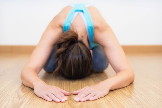 Close up of young woman practicing Yoga.