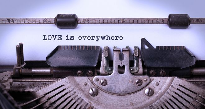 Love is everywhere, written on an old typewriter, vintage