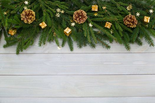 Christmas new year flat lay decor and fir branches on white toned natural wooden plank background texture provence style with copy space for text