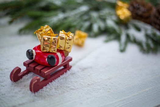 Santa Claus sledge accident in snow with lost gifts around