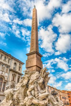 Obelisk and Fountain of the Four Rivers, iconic landmark designed in 1651 by Bernini, located in the famous Piazza Navona, Rome, Italy
