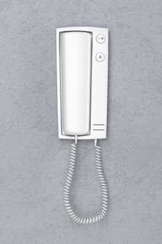 Front view of intercom on gray wall